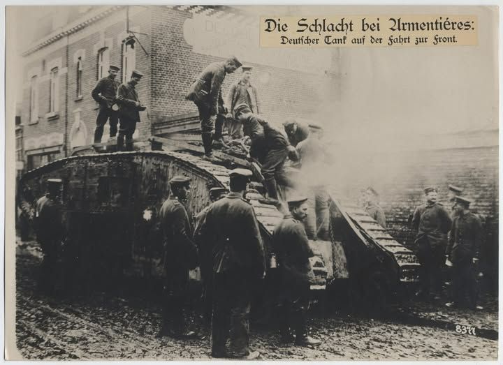 german soliders with a captured british tank at Armentières during the 1918 spring offensive during ww1
