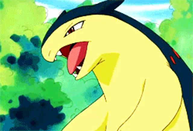 a yellow and blue pokemon with its tongue hanging out