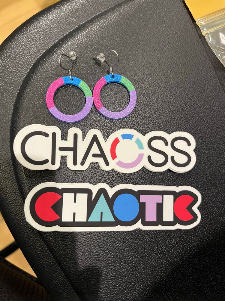2 CHAOSS circle logo earrings. CHAOSS logo and CHAOTIC stickers