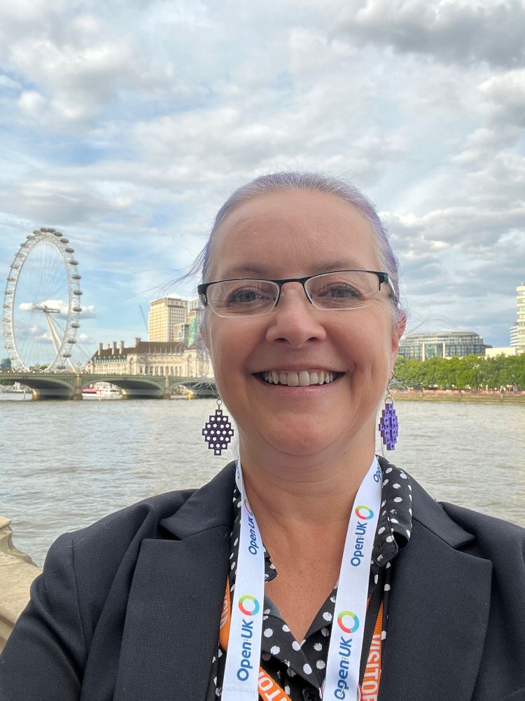 Dawn with a big smile on the House of Commons Terrace with the London eye and the Thames in the background. 