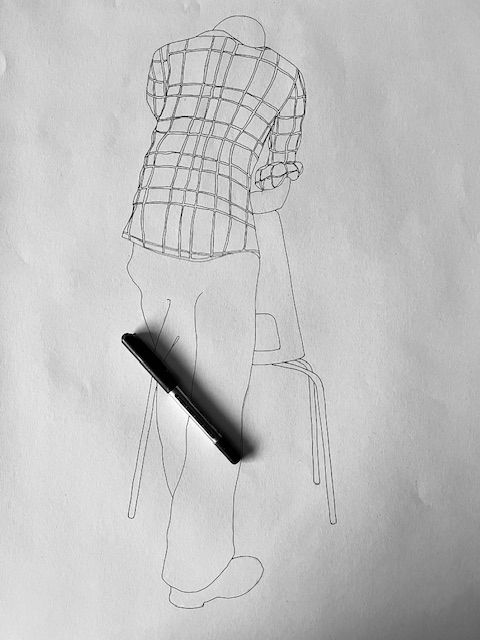 Ink drawing of a person in a checked shirt. Pen in photo to show it is hand drawn. 