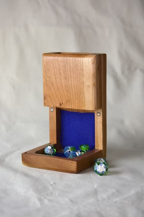 Cherry wood dice tower with blue felt. 
