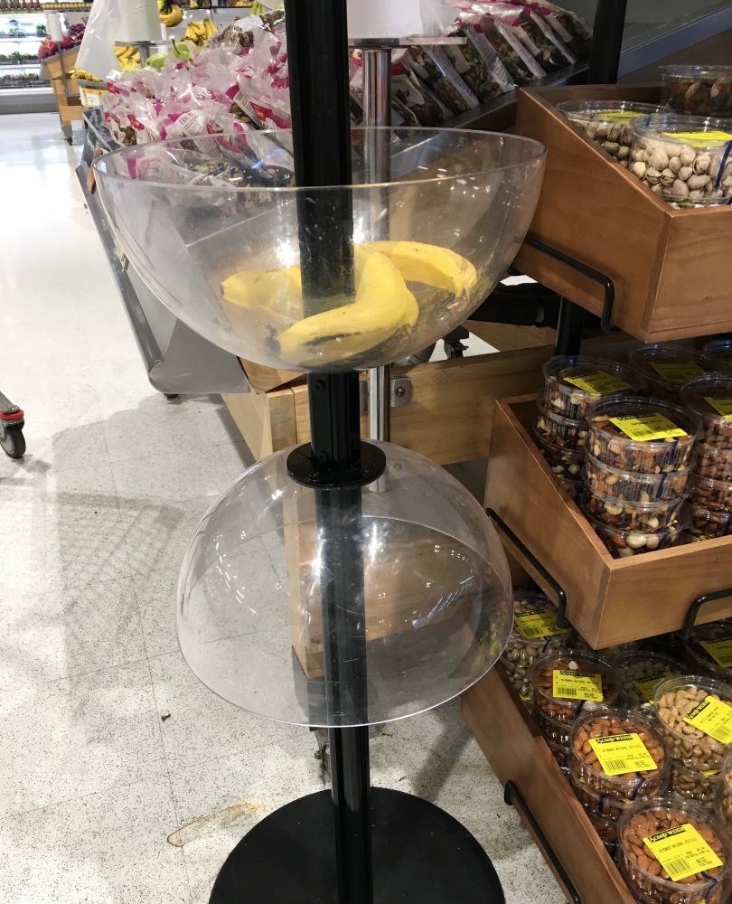 Plastic bowls holding bananas in a supermarket 