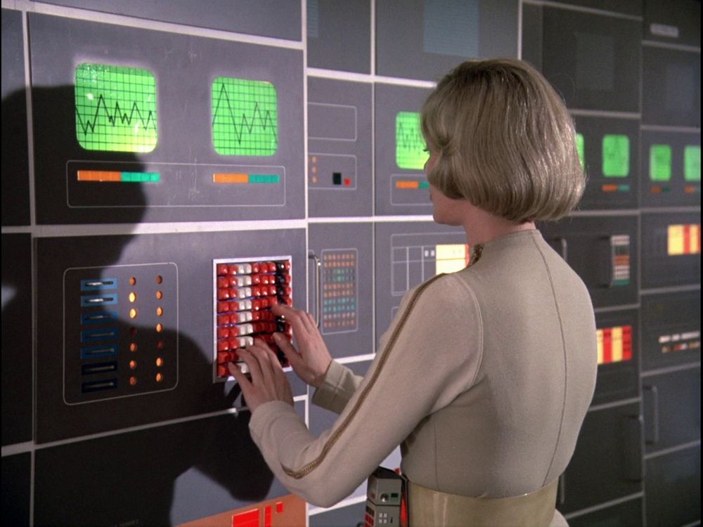 Dr. Helena Russell typing rapidly on a vertical keypad (Space: 1999) 