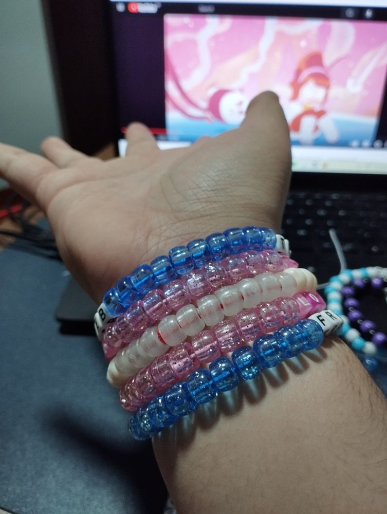 the transgender flag as a kandi bracelet around my wrist (inner arm) 