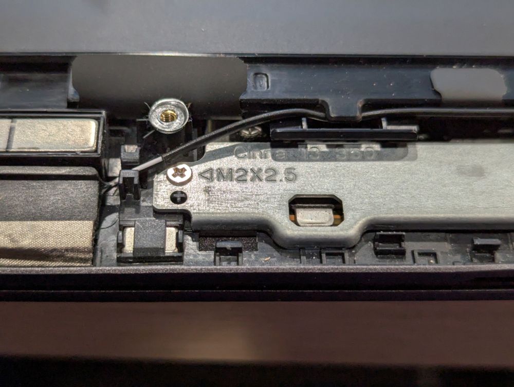 Metal bracket in an HP laptop showing the model code name, Cinna