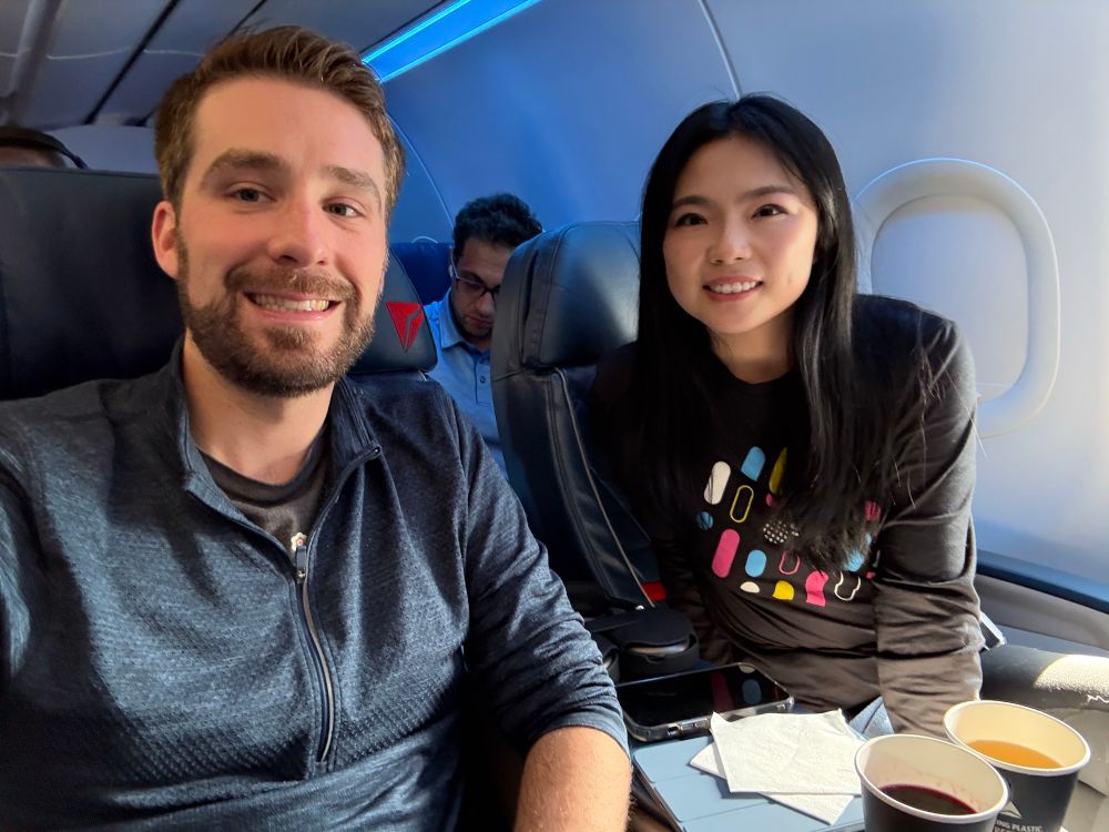 Keegan and Jully sitting on a plane before takeoff 
