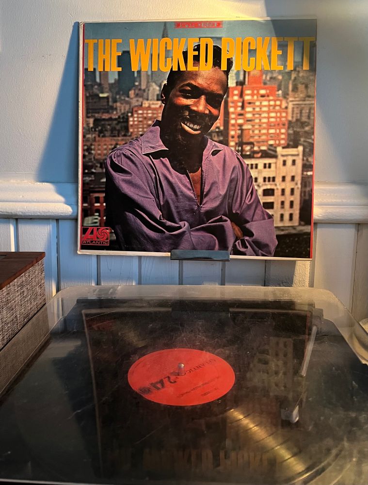 Turntable playing Wilson Pickett’s album The Wicked Pickett with the album cover displayed above. 