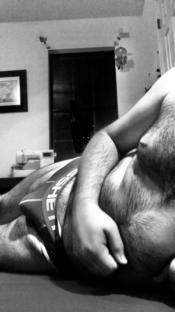 Monochrome photo of me in my underwear laying on my side on the floor. 
