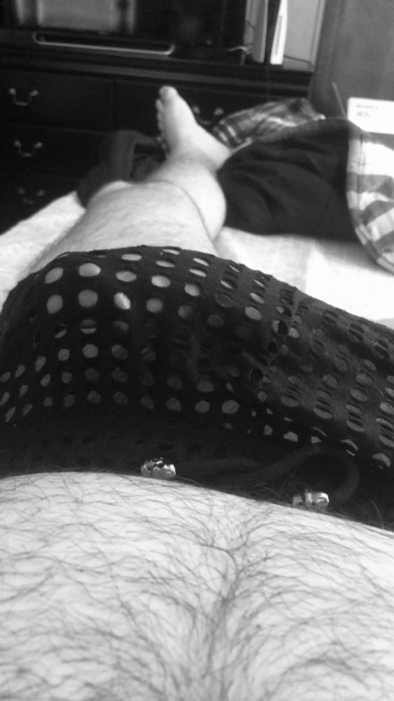 Looking down at my belly and seeing my dick budge through wide spaced mesh underwear. 