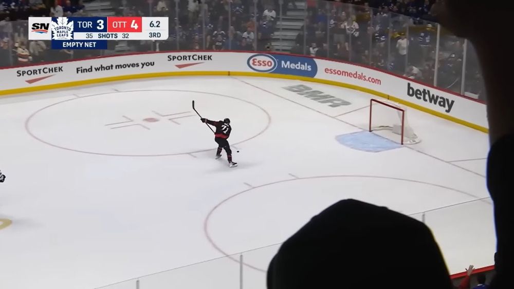 The Ottawa Senators' Ridly Greig scores an empty net slapshot against the Toronto Maple Leafs.