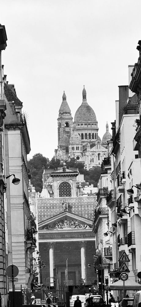 Looking up to Montmartre basilica from a Paris street.