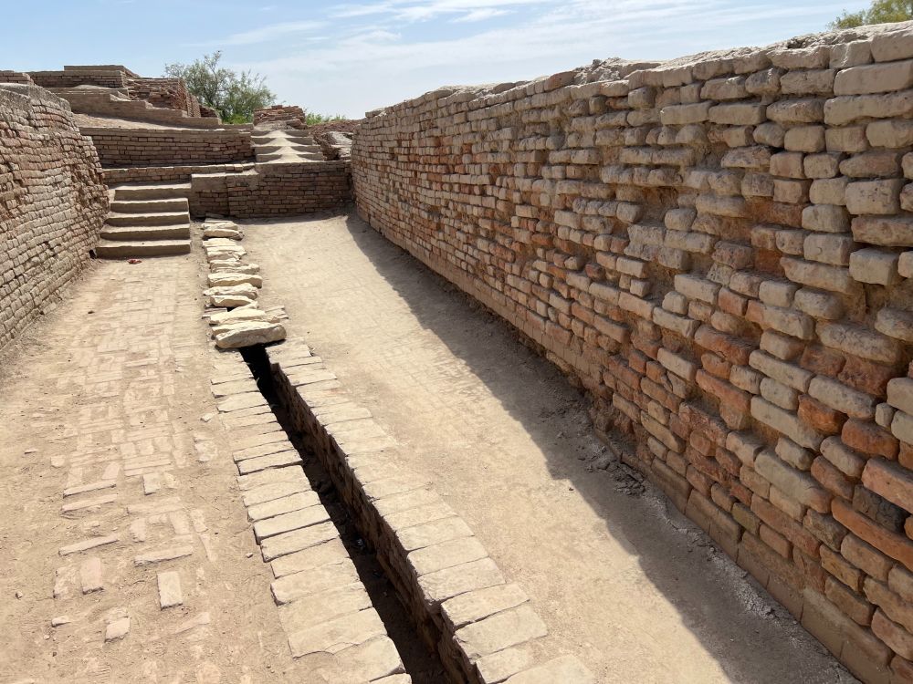 Remains of ancient drainage system made of brick with limestone slabs covering one section
