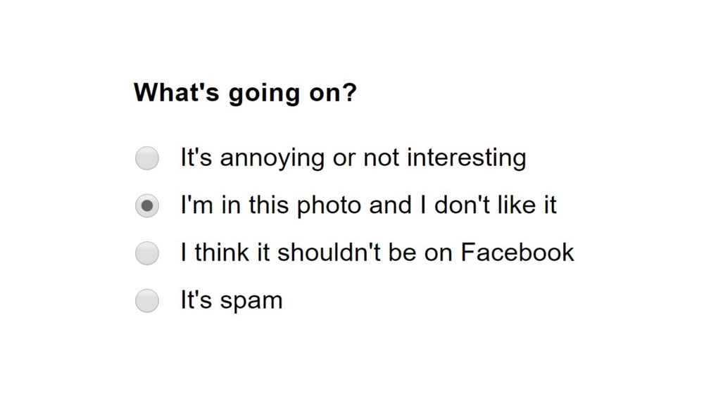 Screenshot of a Facebook dialog for reporting photos, with "I'm in this photo and I don't like it" selected as the reason for submission to moderators