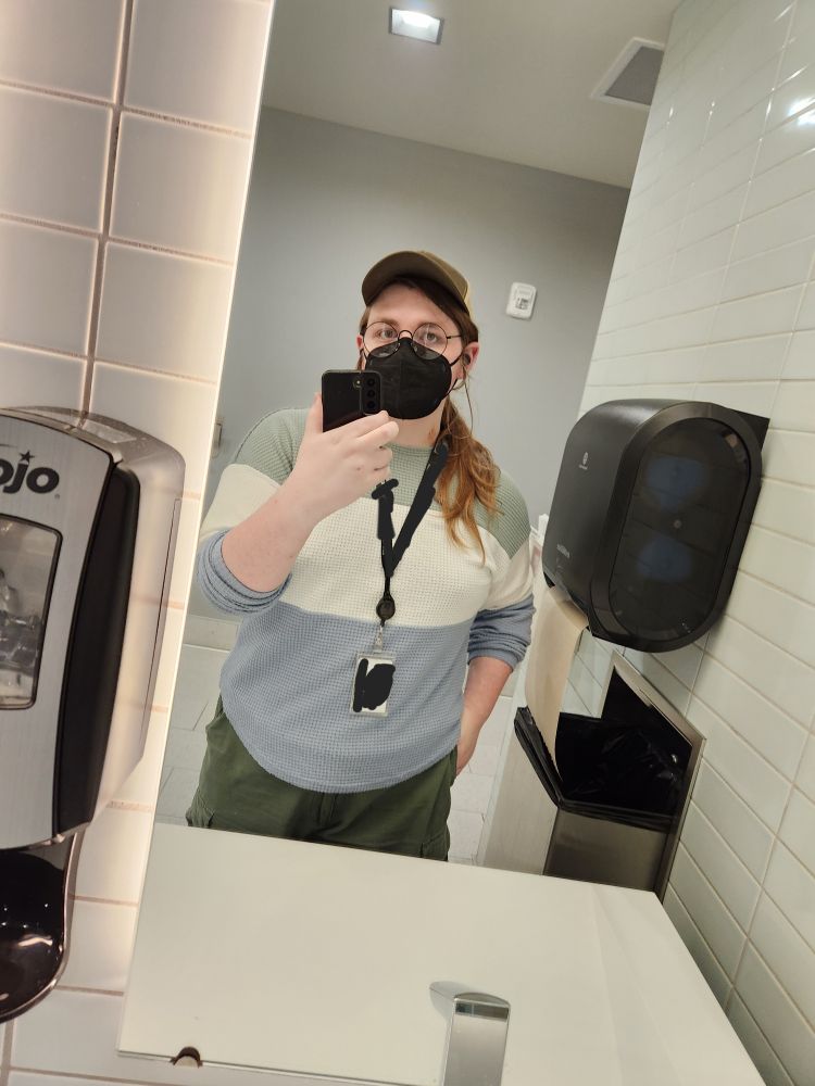 an image of myself in a bathroom wearing a green hat, color block shirt, and green pants. i look cunt as fuck.