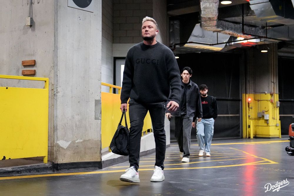 A photo of Miguel Rojas walking into the stadium in Toronto.