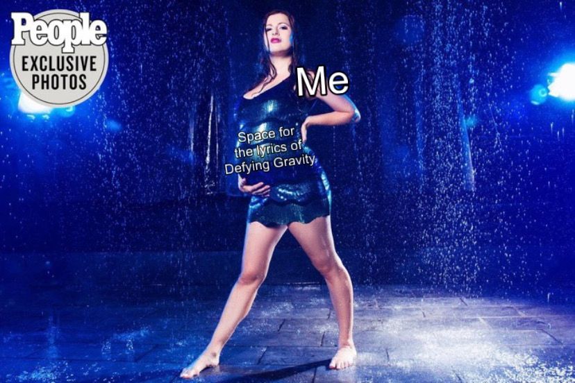 Rachel Reilly’s pregnancy photo shoot for People magazine in the rain with “Me” text on Rachel and “Space for the lyrics of Defying Gravity” on her pregnant stomach that she’s holding