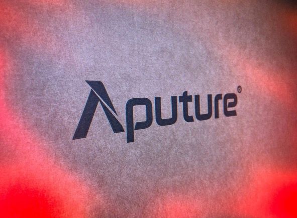 Aputure lighting logo in red spotlight.