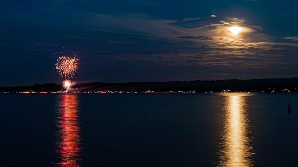 Fireworks and moon over Lake Geneva, WI
