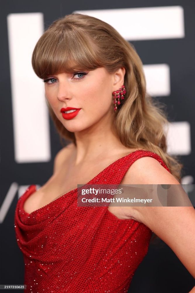 Taylor Swift in a red draped mini dress at the Grammys 