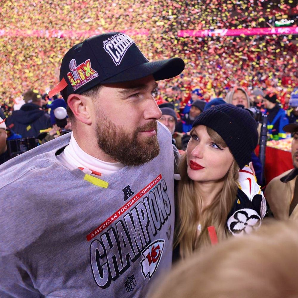 Taylor Swift and Travis kelce on the field after winning the conference championship 
