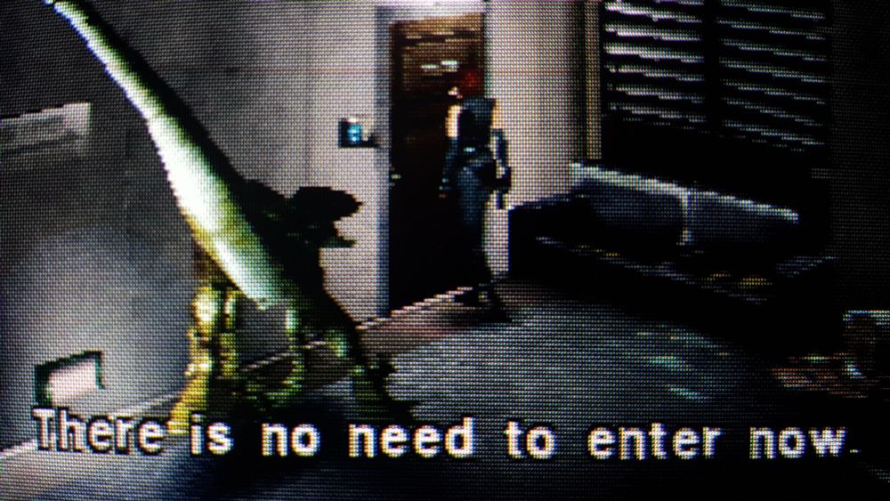 Dino Crisis screen. Regina is trying to enter a room, but the text says "There's no need to enter now." a raptor opens its mouth, ready to pounce.
CRT TV RGB