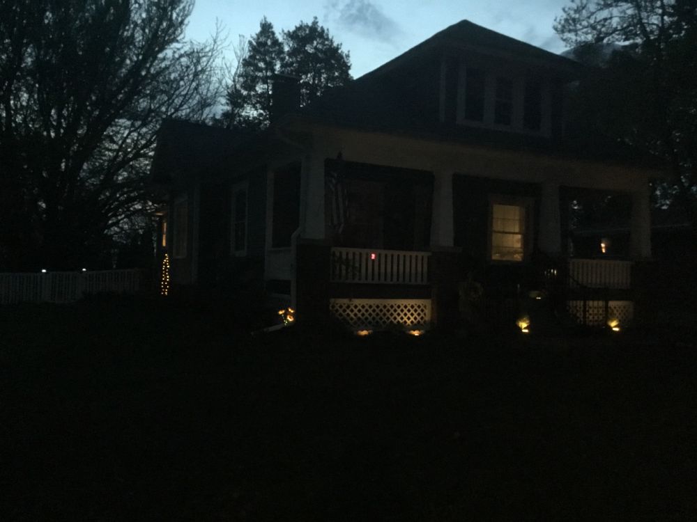 The Blue Bungalow at night. There is a bit of solar lighting going on.