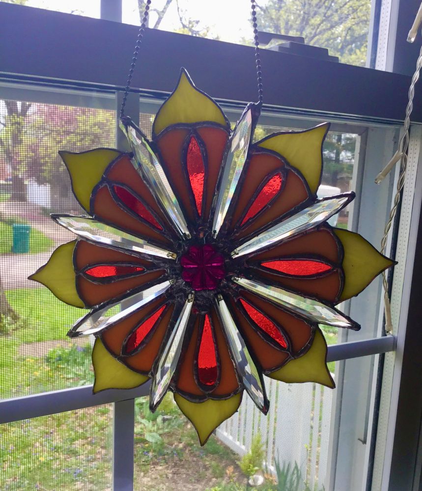 Stained glass flower with crystal petals and red, yellow, orange and purple glass