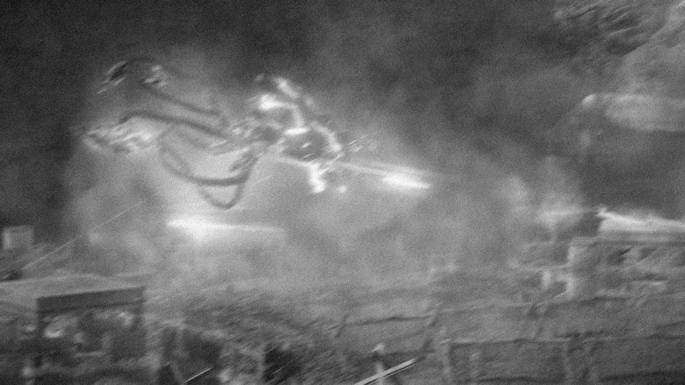 An alien flying machine attacking the heavily fortified mine entrance in the game Crysis.