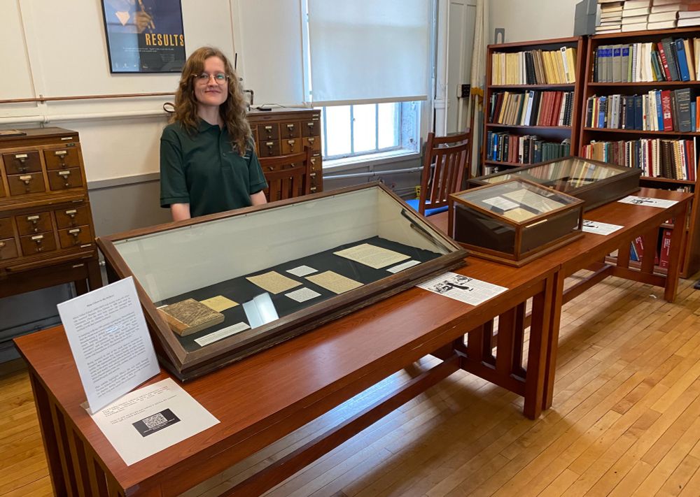 Katherine Hobbs stands at “Mina Edison in the Archives” exhibit