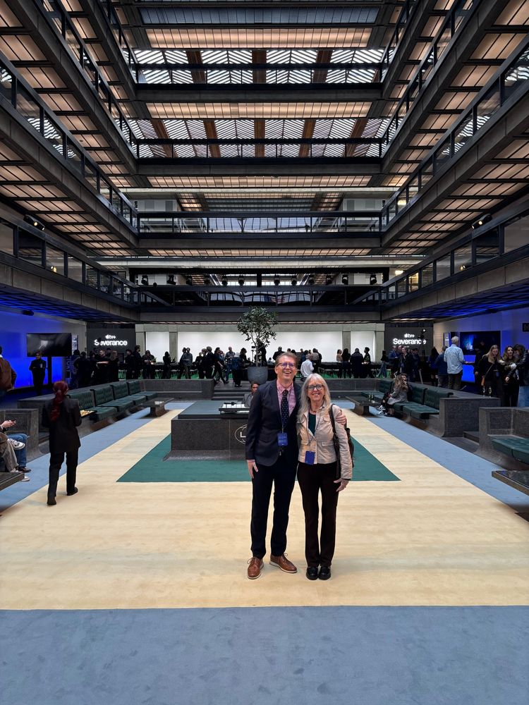 Photo of two people in the Bell Labs building. 