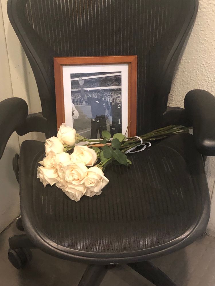 Flowers and a picture of the late James Mims at the entrance to the Dodger Stadium press box. Mims worked for the Dodgers for 45 years.