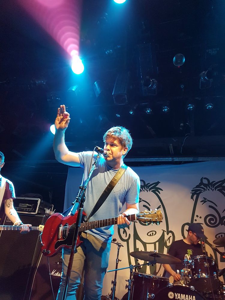 KJ Jansen of Chixdiggit!, May 2018, Montreal (drummer Tyler Pickering and part of bassist Rob Gruszecki also visible) 