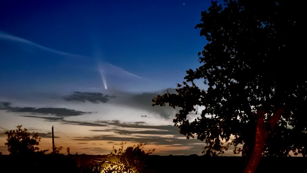The comet in the evening sky
