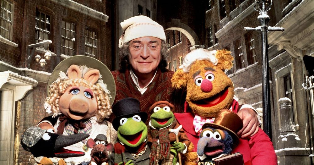 The cast of The Muppet Christmas Carol, with Michael Caine as Scrooge.