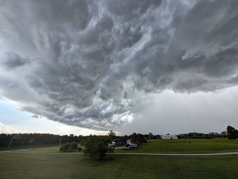 A huge gray thundercloud heading right toward my house. Spoiler: It's now raining a whole lot here. 