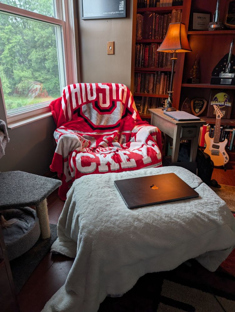 The one over the chair is an Ohio State fuzzy blanket, probably made from recycled two liter bottles