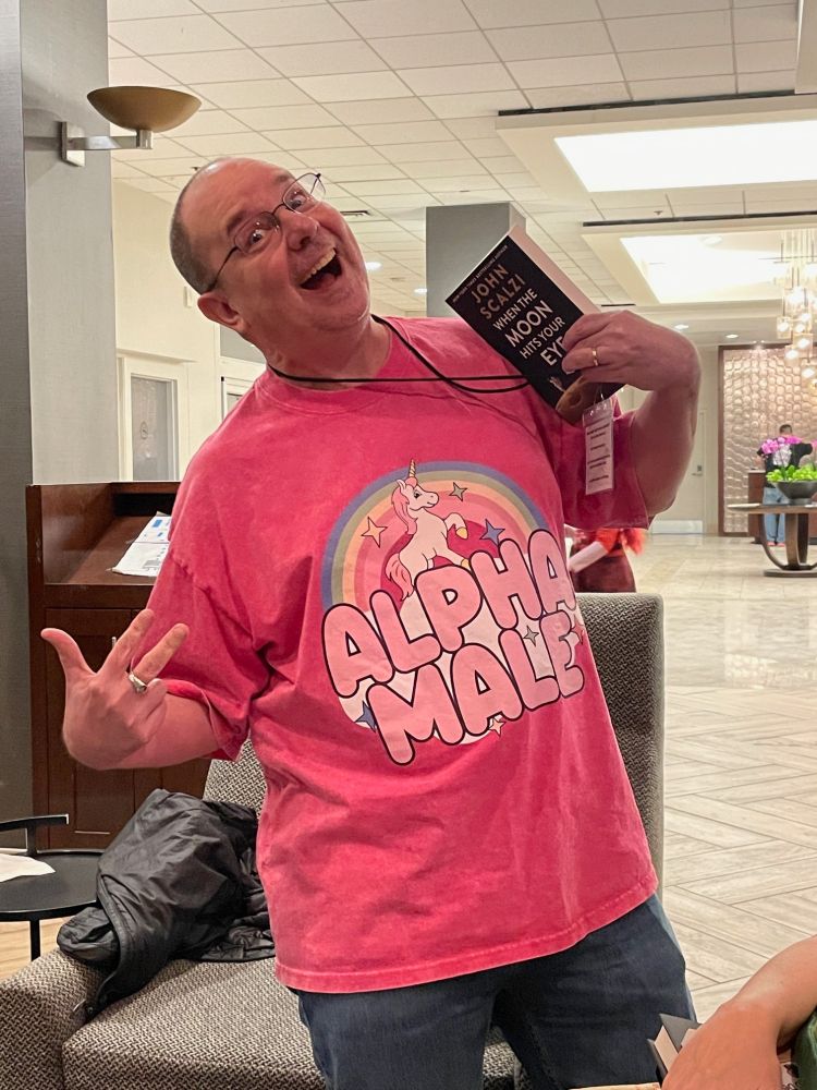 Me in my pink "Alpha Male" t shirt, with a cuddly unicorn on it!