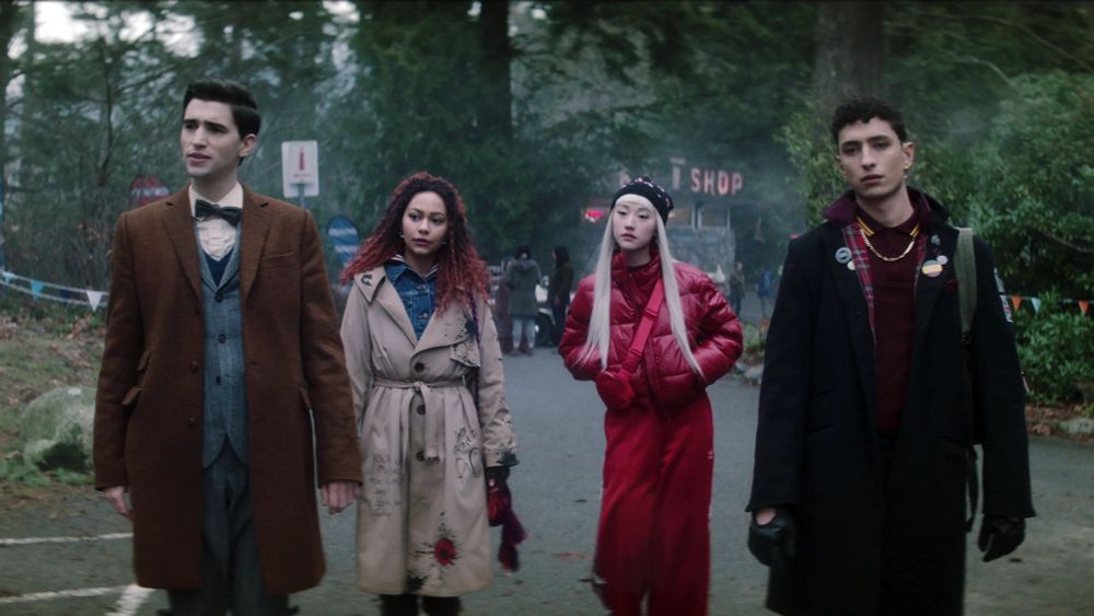 The four leads of The Dead Boy Detectives, looking like they heading off to tea and then a cozy listen to a true crime podcast