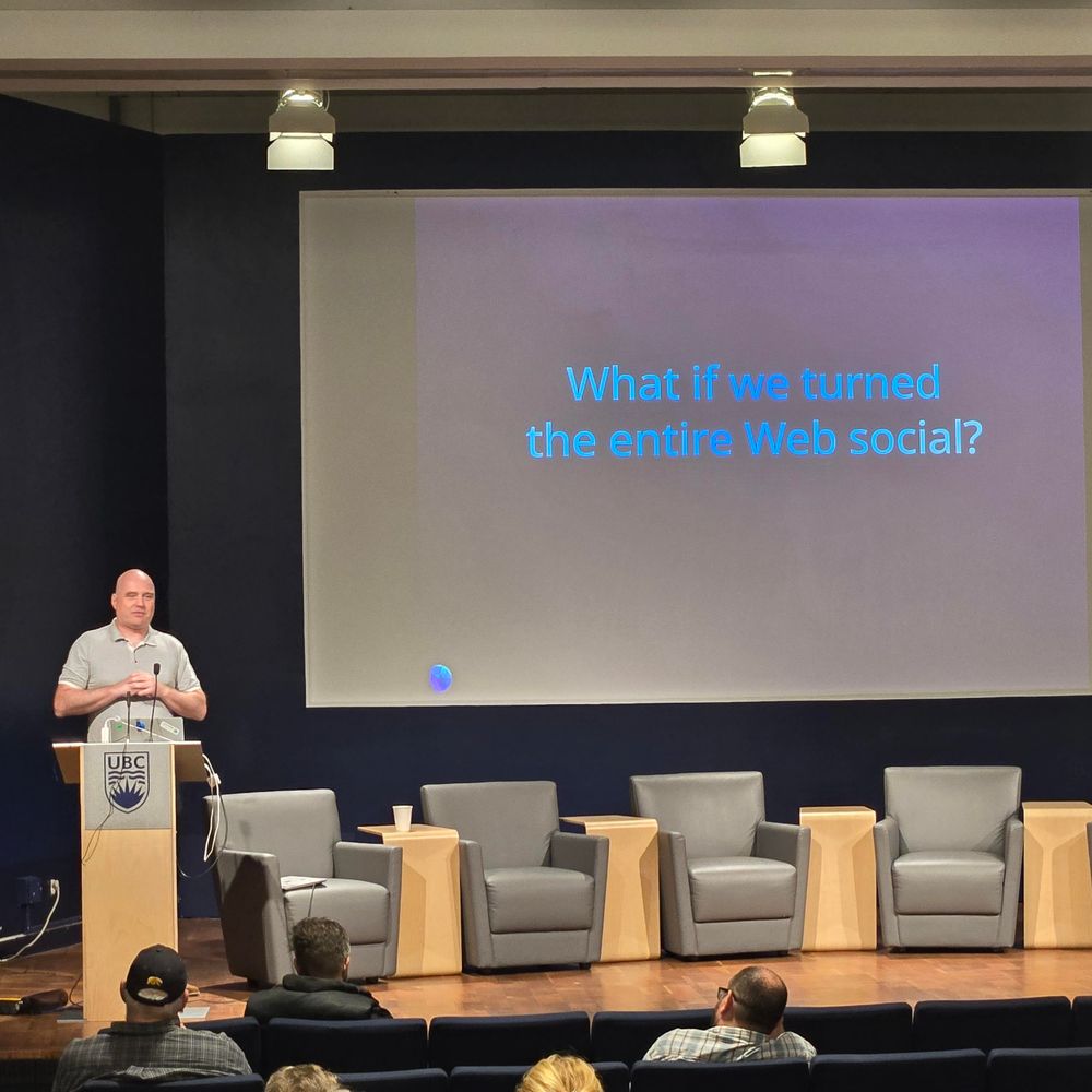 Johannes Ernst at Fedicon with a slide that says "what if turned the entire web social"