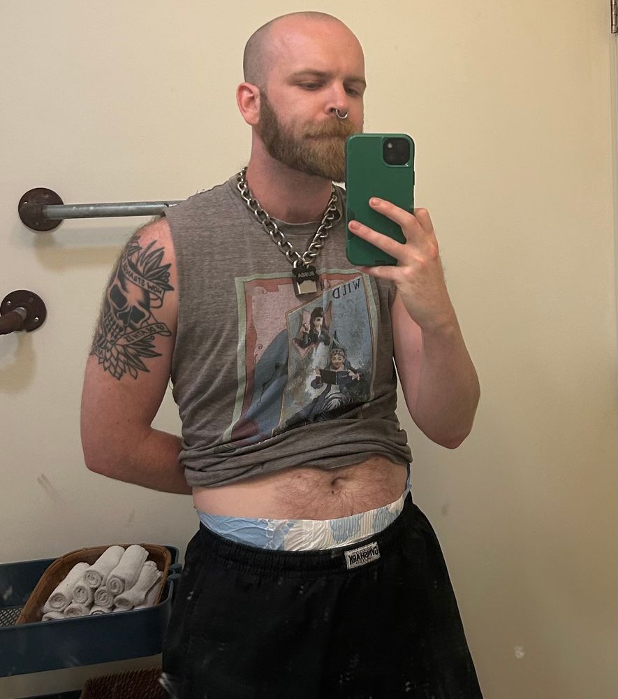 bubba lifts up their shirt to show off a peek of a plastic waistband… what could that be?