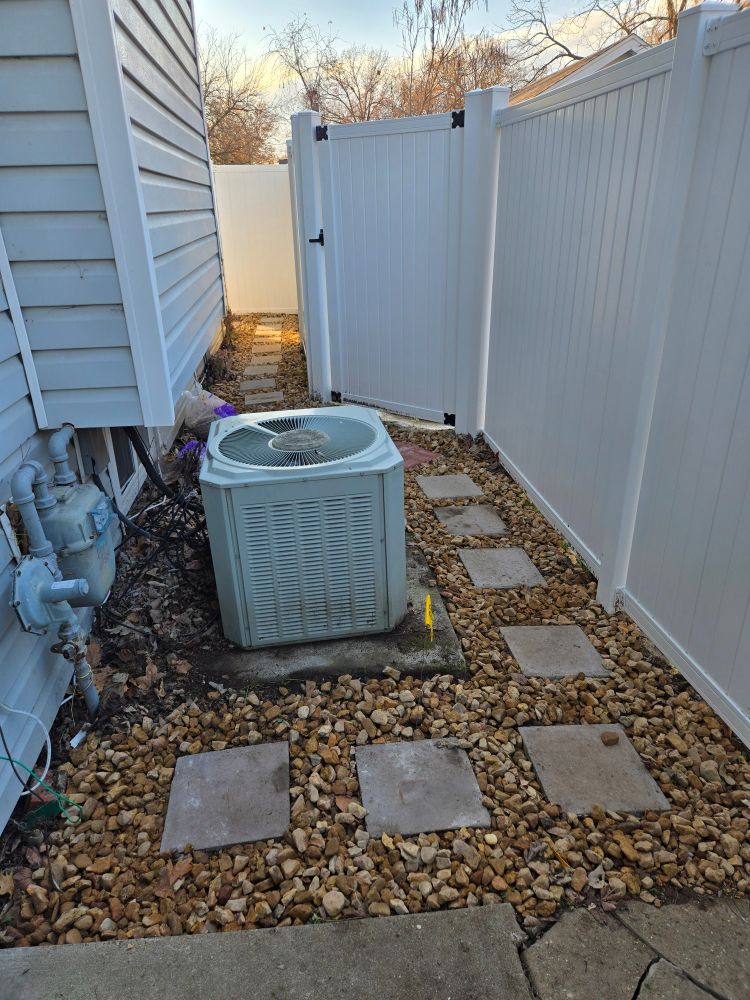 Brick pavers and fresh gravel freshly installed today along a formerly muddy walkway