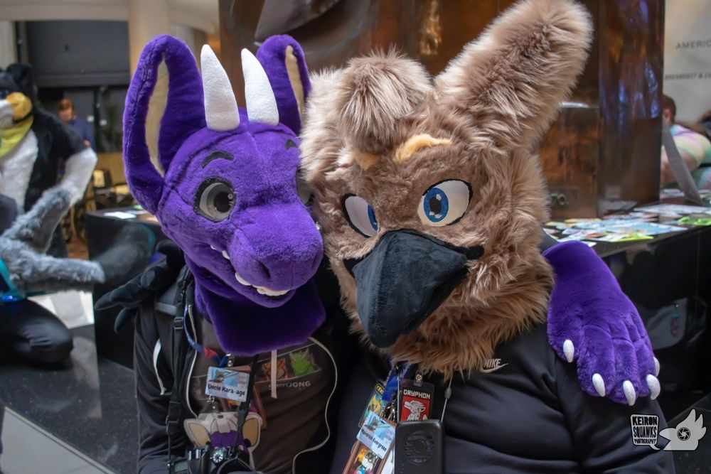 A picture with Adelair (a purple dragon fursuiter) and Maverick (a brown gryphon fursuiter)