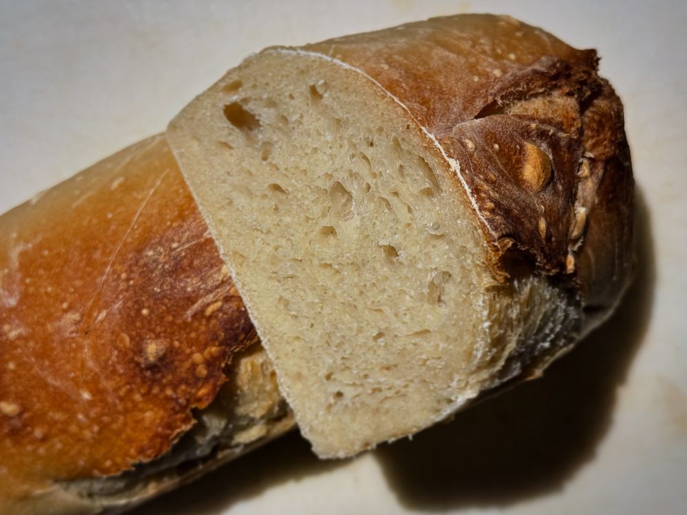Sourdough bread loaf, cut in half and stacked artistically for a sourdough fashion show.