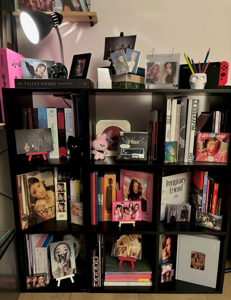 closer look at the cube shelves filled with various k-pop artists 