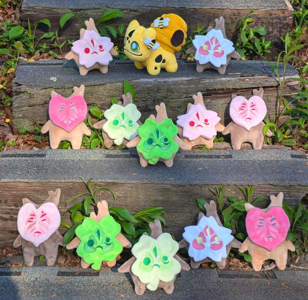 A collection of handmade Spring-themed plushies.  Includes Koroks from the Legend of Zelda and Bulbasaur from Pokemon.