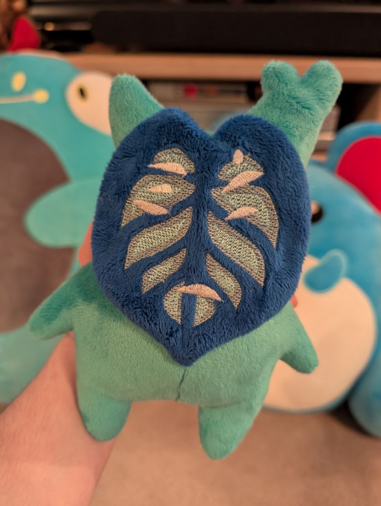 A handmade MLM/Gay Pride Korok plushie from the Legend of Zelda.