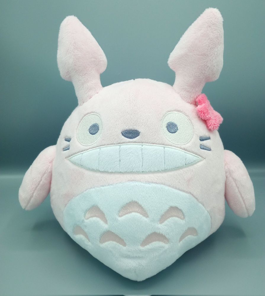 A handmade pink Totoro plushie from the Studio Ghibli movie My Neighbor Totoro.