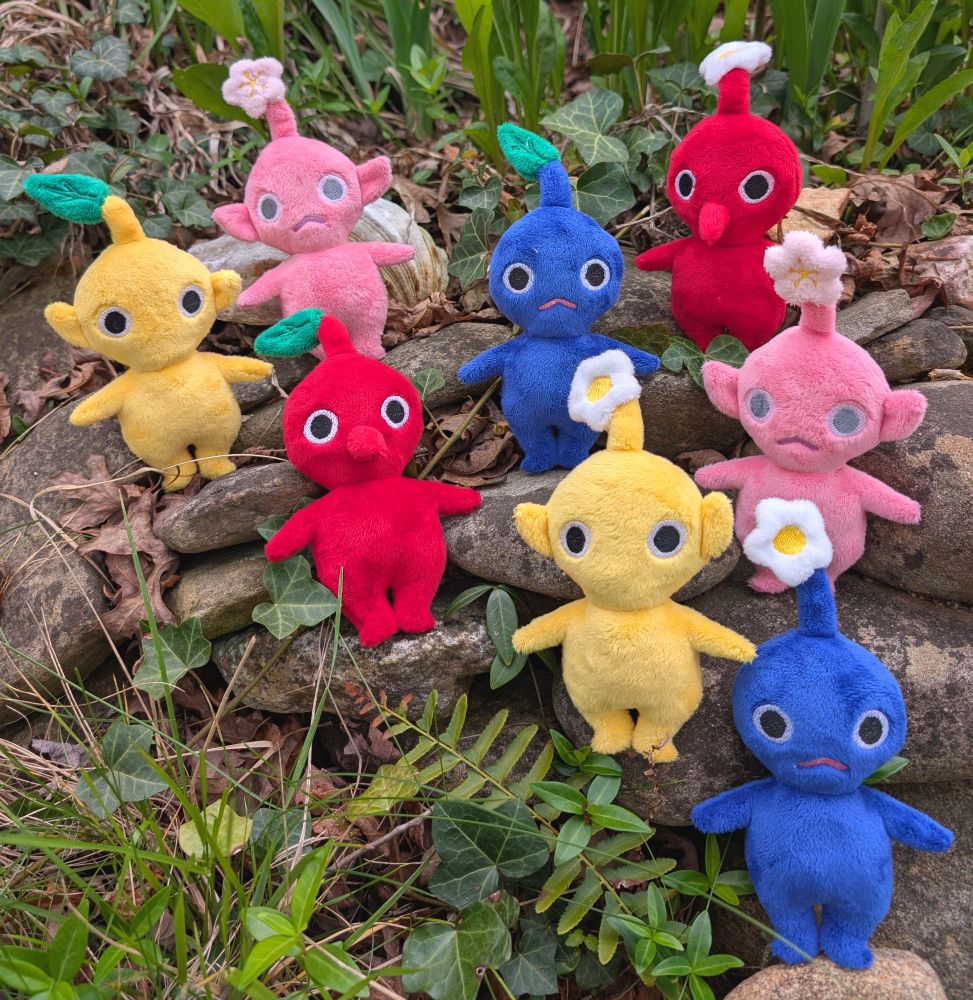 A collection of handmade Pikmin plushies.