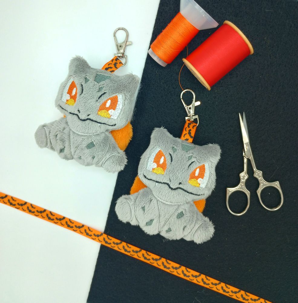 Two handmade Pumpkin Bulbasaur plushie keychains from Pokemon.